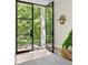 Open entryway with glass door, leading to a lush outdoor view at 21 Barksdale Ne Dr, Atlanta, GA 30309