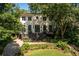 Beautiful two-story home with lush greenery and a well-manicured front yard at 21 Barksdale Ne Dr, Atlanta, GA 30309