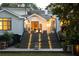 Exterior of home with lit staircase leading to patio with outdoor seating at 21 Barksdale Ne Dr, Atlanta, GA 30309