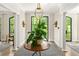 Inviting foyer with grand columns and a striking round table centerpiece at 21 Barksdale Ne Dr, Atlanta, GA 30309