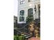 Elegant home entrance with brick stairs and black railing at 21 Barksdale Ne Dr, Atlanta, GA 30309