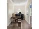 Bright hallway featuring an office nook, hardwood floors, and neutral paint at 21 Barksdale Ne Dr, Atlanta, GA 30309