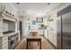 Bright, spacious kitchen with an island, stainless steel appliances, and custom white cabinets at 21 Barksdale Ne Dr, Atlanta, GA 30309