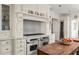 Gourmet kitchen featuring stainless steel appliances, custom cabinetry, and a center island at 21 Barksdale Ne Dr, Atlanta, GA 30309
