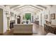 Spacious living room with a beamed ceiling, fireplace, hardwood floors, and a view to the exterior at 21 Barksdale Ne Dr, Atlanta, GA 30309