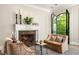 Cozy living room featuring a marble fireplace and comfortable seating at 21 Barksdale Ne Dr, Atlanta, GA 30309