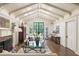Bright living room with vaulted ceilings, fireplace, and doors leading to the outside at 21 Barksdale Ne Dr, Atlanta, GA 30309