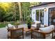 Covered patio with outdoor seating and view of manicured backyard at 21 Barksdale Ne Dr, Atlanta, GA 30309
