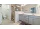 Bathroom with double sink vanity and glass shower at 2252 Talmai Dr, Snellville, GA 30078