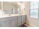 Bathroom featuring a double sink vanity and window at 2252 Talmai Dr, Snellville, GA 30078
