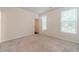 Bright bedroom with plush carpeting, large windows, and a walk-in closet at 2252 Talmai Dr, Snellville, GA 30078