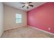 Bedroom featuring carpeted floors, ceiling fan and a window at 2252 Talmai Dr, Snellville, GA 30078