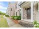 Welcoming front entrance showcasing brick steps, a brown front door, and white trim at 2252 Talmai Dr, Snellville, GA 30078