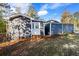 Rear exterior of home with white door entry at 389 Oglesby Bridge Se Rd, Conyers, GA 30094