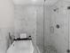 Luxurious bathroom featuring a soaking tub and glass-enclosed shower at 389 Oglesby Bridge Se Rd, Conyers, GA 30094