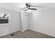 Bedroom featuring carpet flooring, a ceiling fan, a window, and a closet with louvered doors at 389 Oglesby Bridge Se Rd, Conyers, GA 30094