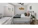 Serene bedroom featuring stylish decor, a cozy bed, and plenty of natural light at 389 Oglesby Bridge Se Rd, Conyers, GA 30094