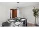 Comfortable dining room featuring modern lighting fixture and table setting at 389 Oglesby Bridge Se Rd, Conyers, GA 30094