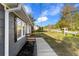 Charming home featuring a well-maintained front yard, walkway and 'For Sale' sign at 389 Oglesby Bridge Se Rd, Conyers, GA 30094