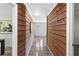 Hallway with wood-paneled walls leading to the main entrance at 389 Oglesby Bridge Se Rd, Conyers, GA 30094
