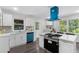 Updated kitchen featuring modern appliances and quartz countertops at 389 Oglesby Bridge Se Rd, Conyers, GA 30094
