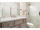 Well-lit bathroom with marble countertop, stylish vanity, and glass-enclosed shower at 612 Concord Lake Se Cir, Smyrna, GA 30082