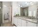 Modern bathroom with granite countertops, double sinks, and a glass-enclosed shower at 612 Concord Lake Se Cir, Smyrna, GA 30082