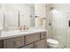 Bright bathroom features a marble countertop, stylish vanity, and a glass-enclosed shower with subway tile at 612 Concord Lake Se Cir, Smyrna, GA 30082