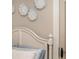 Bedroom headboard with neutral bedding and decorative wall accents above at 612 Concord Lake Se Cir, Smyrna, GA 30082