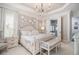 Elegant bedroom featuring a decorative chandelier, a sitting area, and ensuite bathroom access at 612 Concord Lake Se Cir, Smyrna, GA 30082