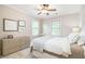 Bright bedroom with natural light, dresser, and neutral color scheme at 612 Concord Lake Se Cir, Smyrna, GA 30082