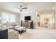 Large bonus room with comfortable seating, ceiling fan and staircase visible at 612 Concord Lake Se Cir, Smyrna, GA 30082