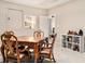 Charming dining area with wooden table, chair set, and built-in shelving at 612 Concord Lake Se Cir, Smyrna, GA 30082