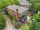 Back exterior view of home featuring a charming screened-in porch and lush landscaping at 612 Concord Lake Se Cir, Smyrna, GA 30082