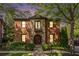 A stately brick home with stone accents and manicured landscaping at 612 Concord Lake Se Cir, Smyrna, GA 30082