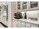 Contemporary kitchen with custom white cabinetry and a built-in espresso machine at 612 Concord Lake Se Cir, Smyrna, GA 30082