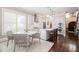 Spacious kitchen with a large island, stainless steel appliances, and a dining area at 612 Concord Lake Se Cir, Smyrna, GA 30082