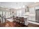 Bright, open kitchen with an island and barstool seating flows into a welcoming living space at 612 Concord Lake Se Cir, Smyrna, GA 30082