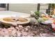 Lush landscaping with a birdbath and stone rabbit statue creates a serene outdoor garden area at 612 Concord Lake Se Cir, Smyrna, GA 30082