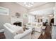 Elegant living room with a fireplace, hardwood floors, and an open concept layout at 612 Concord Lake Se Cir, Smyrna, GA 30082
