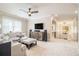 Spacious living room with neutral decor, a ceiling fan, and abundant natural light at 612 Concord Lake Se Cir, Smyrna, GA 30082
