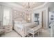 Well-lit main bedroom with a chandelier, neutral tones, and a glimpse into the bathroom at 612 Concord Lake Se Cir, Smyrna, GA 30082