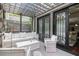 Covered outdoor patio with comfortable seating and an intricately designed screen at 612 Concord Lake Se Cir, Smyrna, GA 30082
