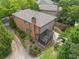 A beautiful brick home featuring a screened-in porch and lush landscaping at 612 Concord Lake Se Cir, Smyrna, GA 30082