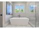 Modern bathroom features a soaking tub, walk-in shower, and stylish tile work at 115 Trinity Hollow Dr, Canton, GA 30115
