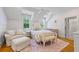 Cozy bedroom with a sitting area, soft colors, and hardwood floors at 115 Trinity Hollow Dr, Canton, GA 30115