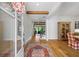 Elegant foyer with hardwood floors, wooden beams, modern staircase, and view to the outside at 115 Trinity Hollow Dr, Canton, GA 30115
