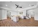Cozy living room featuring a neutral sofa, hardwood floors and access to the bath at 115 Trinity Hollow Dr, Canton, GA 30115
