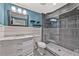 Modern bathroom with glass-enclosed shower, floating shelves, and marble countertop sink at 4733 Julian Way, Acworth, GA 30101