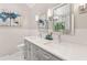 Bathroom with dual vanity, large mirrors, and modern lighting fixtures at 4733 Julian Way, Acworth, GA 30101